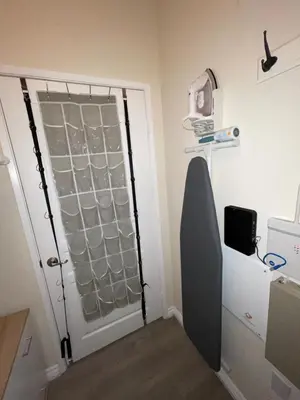 a room with a door with a window and a shelf at Resort like stay in a lovely room near UCI in Irvine