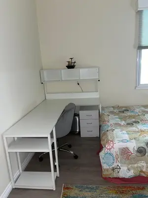 a bedroom with a desk and a bed and a desk and a desk and chair at Resort like stay in a lovely room near UCI in Irvine