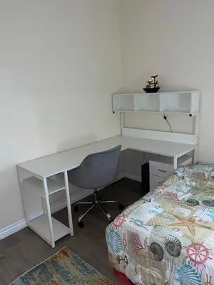 a desk and a bed in a room with a desk and a deskictericter at Resort like stay in a lovely room near UCI in Irvine