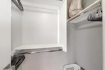 a bathroom with a white cabinet and a toilet at Walk to Mission Beach Centrally Located Townhome in San Diego