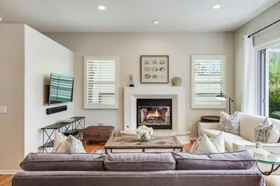 a living room with a couch and a fireplace at Draper Oasis Ocean vVews in San Diego