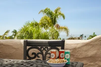 a table with a bowl of chips and condiments at Draper Oasis Ocean vVews in San Diego