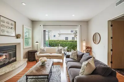 a living room with a couch and a fireplace at Draper Oasis Ocean vVews in San Diego