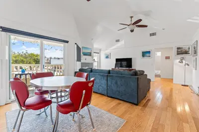 a living room with a table and chairs and a couch at Felspar Sanctuary in San Diego