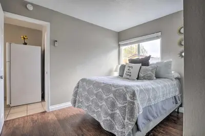 a bedroom with a bed and a window at Relaxing Poway Apt with Patio Near Parks and Wineries! in Poway
