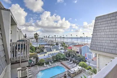 a view of a city with a pool and the ocean at Charming Oceanside Condo with Beach and Pool Access! in Oceanside
