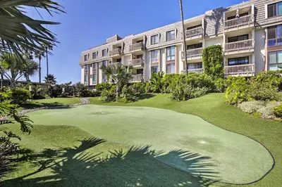 a golf course in front of a building at Charming Oceanside Condo with Beach and Pool Access! in Oceanside