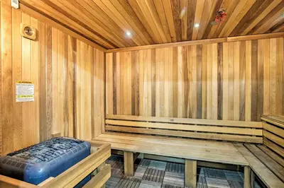 a sauna with a bench in a wooden room at Charming Oceanside Condo with Beach and Pool Access! in Oceanside