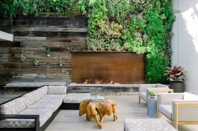 a living room with a couch and a fireplace at SCP Seven4One Hotel in Laguna Beach