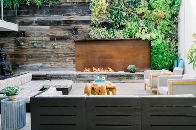 a fountain in a courtyard with a fire place at SCP Seven4One Hotel in Laguna Beach