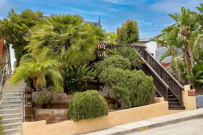 a set of stairs with plants and trees at Canyon Palms in San Diego