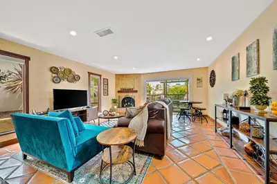a living room filled with furniture and a tv at Canyon Palms in San Diego