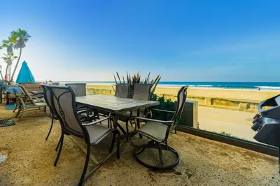 a table and chairs sitting on the beach at Santa Barbara Unit #2 in San Diego