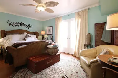a bedroom with a bed and a couch at Coastal Hideaway in Carlsbad