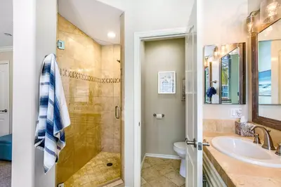 a bathroom with a shower and a sink at Carlsbad Village Charm in Carlsbad