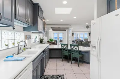 a kitchen with a sink and a counter at The Strand Oasis in Oceanside