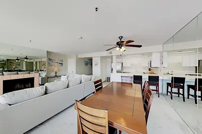 a large living room with a couch and a table at Imperial Beach Club in Imperial Beach