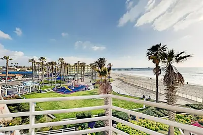 a view of the beach from the balcony of a resort at Imperial Beach Club in Imperial Beach