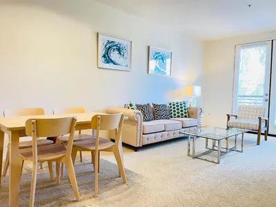 a living room with a table and a couch at Luxury Irvine 2Bedrooms 2Bathrooms kitchen Pool apartment in Irvine
