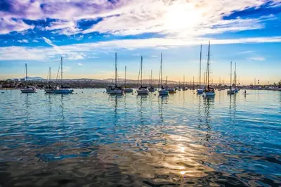 a group of boats sitting in the water at Cheery Retreat in Newport Beach
