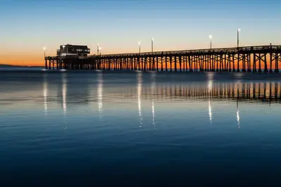 a pier in the middle of the water at Cheery Retreat in Newport Beach