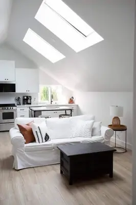 a white living room with a white couch and a table at Coastal, Elegant, Modern, King Bed in San Diego