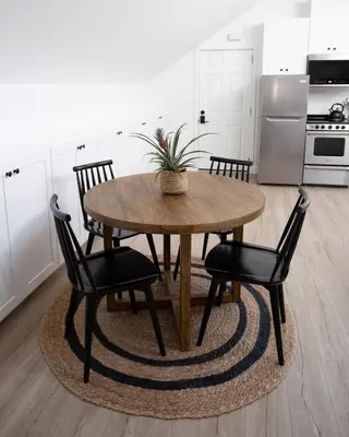 a kitchen with a wooden table and four chairs at Coastal, Elegant, Modern, King Bed in San Diego