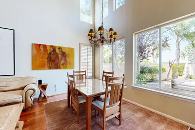 a dining room with a table and chairs at Torrey Treats House in San Diego