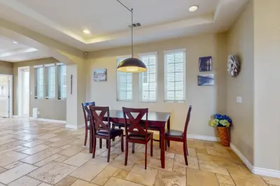 a dining room with a table and chairs at Westwood House in Oceanside