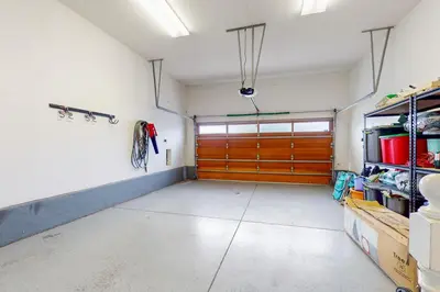 a garage with a large wooden garage door at Westwood House in Oceanside