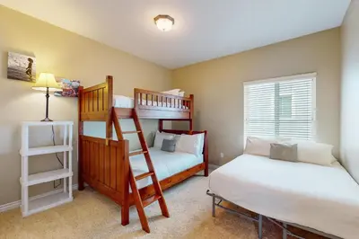 a bedroom with two bunk beds and a bed at Westwood House in Oceanside