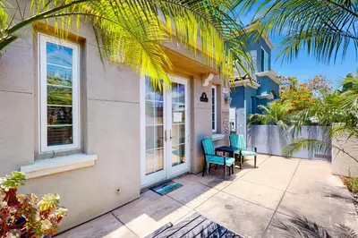 a house with a patio with a table and chairs at Westwood House in Oceanside