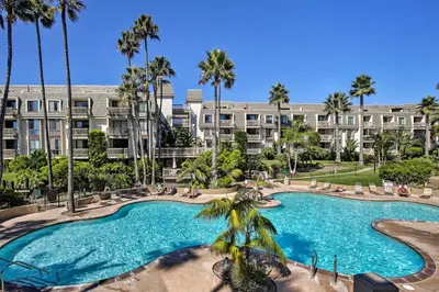 an image of a swimming pool at a resort at Stunning Oceanside Condo Walk to the Beach! in Oceanside