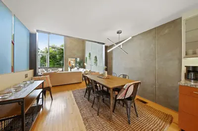 a kitchen and dining room with a table and chairs at New York Style Penthouse in the heart of the city in San Diego