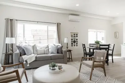 a living room with a couch and a table at The Rosemont IV - La Jolla Luxury in San Diego