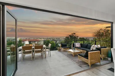 an outdoor patio with a view of the city at The California II - Mission Hills Hideaway in San Diego
