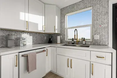 a white kitchen with a sink and a window at The California II - Mission Hills Hideaway in San Diego