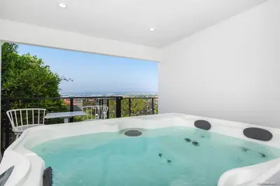 a jacuzzi tub in a room with a balcony at The California II - Mission Hills Hideaway in San Diego