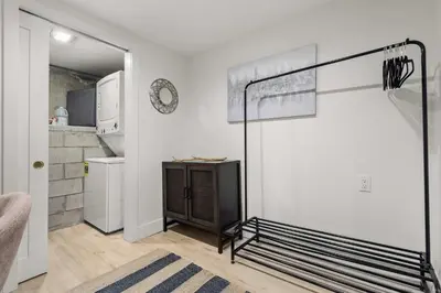 a bedroom with a bed and a kitchen at The California III in San Diego