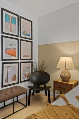 a living room with a chair and pictures on the wall at No bad days in San Diego in San Diego