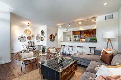 a living room with a couch and a table at Your Home in San Diego - Two-Car Garage in San Diego