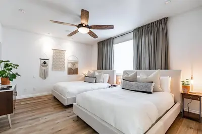 a bedroom with two beds and a ceiling fan at Your Home in San Diego - Two-Car Garage in San Diego