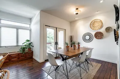 a dining room with a wooden table and chairs at Your Home in San Diego - Two-Car Garage in San Diego