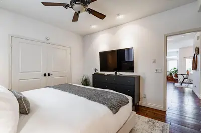 a bedroom with a bed and a flat screen tv at Your Home in San Diego - Two-Car Garage in San Diego