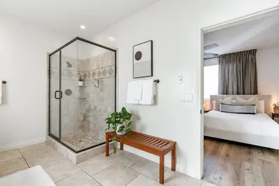 a white bedroom with a shower and a bed at Your Home in San Diego - Two-Car Garage in San Diego