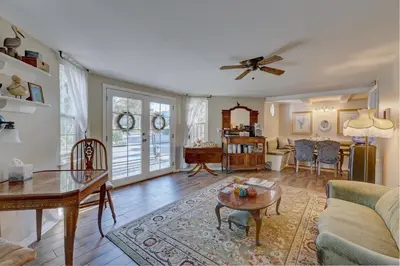 a living room with a couch and a table at Pelican Cove Inn in Carlsbad