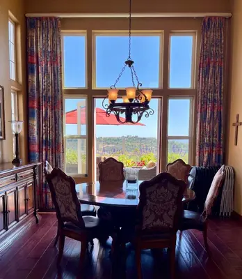 a dining room with a table and a large window at Rare Newport Coast Home for July & August this Summer in Newport Beach