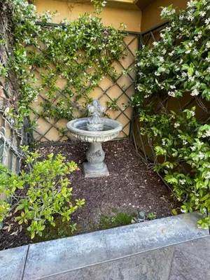 a stone fountain sitting in front of a building at Rare Newport Coast Home for July & August this Summer in Newport Beach