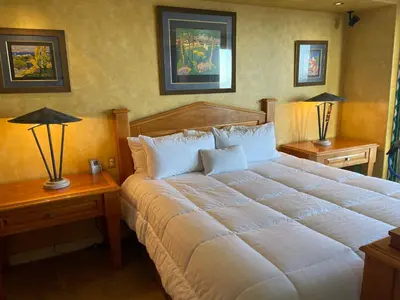 a bedroom with a large white bed with two night tables at Rare Newport Coast Home for July & August this Summer in Newport Beach