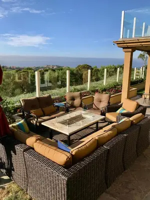 a large patio with couches and a table and chairs at Rare Newport Coast Home for July & August this Summer in Newport Beach